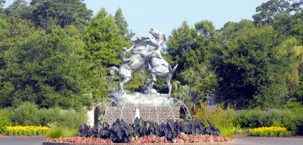 The statue is of two horses engaged in a feverous battle. The horse on the left has a rider on its back, while the horse on the right has lost its rider. The right horse’s rider is cowering underneath the horse.